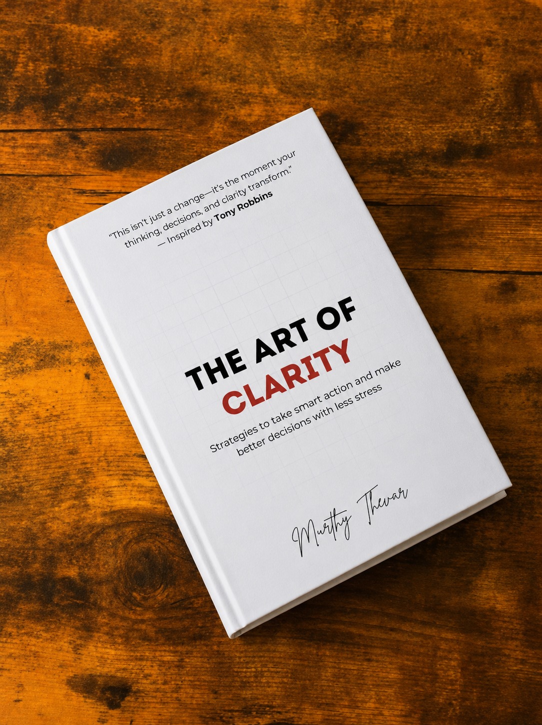 The Art of Clarity by Murthy Thevar, self-help book on clarity and better decisions, held in hand The Art of Clarity by Murthy Thevar, self-help book on clarity and better decisions, held in hand